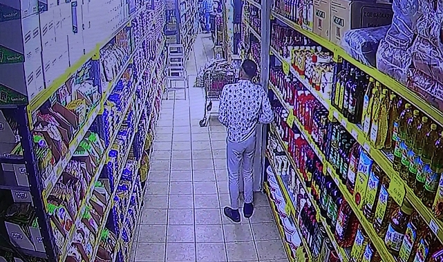 Müşteri gibi giren hırsız, ayçiçek yağını pantolonunun içine sokarak çaldı